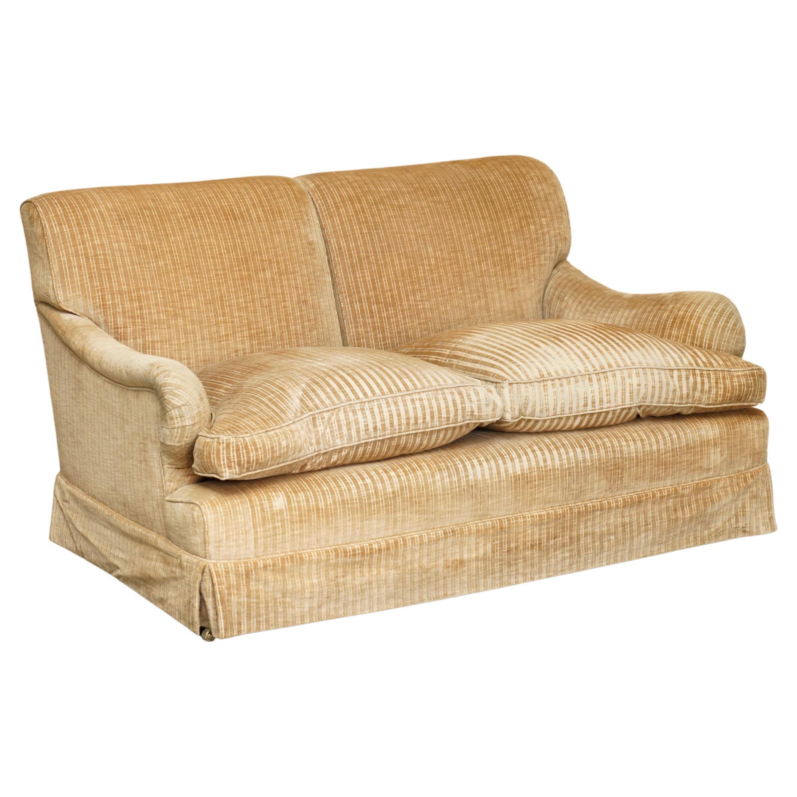 Howard & Sons / Chairs Ltd two-seater canapé with feather-filled cushions.