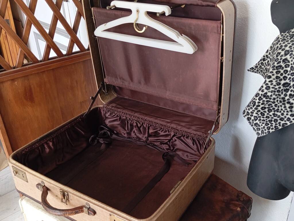 1930s Oshkosh suitcase with bakelite hangers
