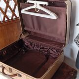 1930s Oshkosh suitcase with bakelite hangers