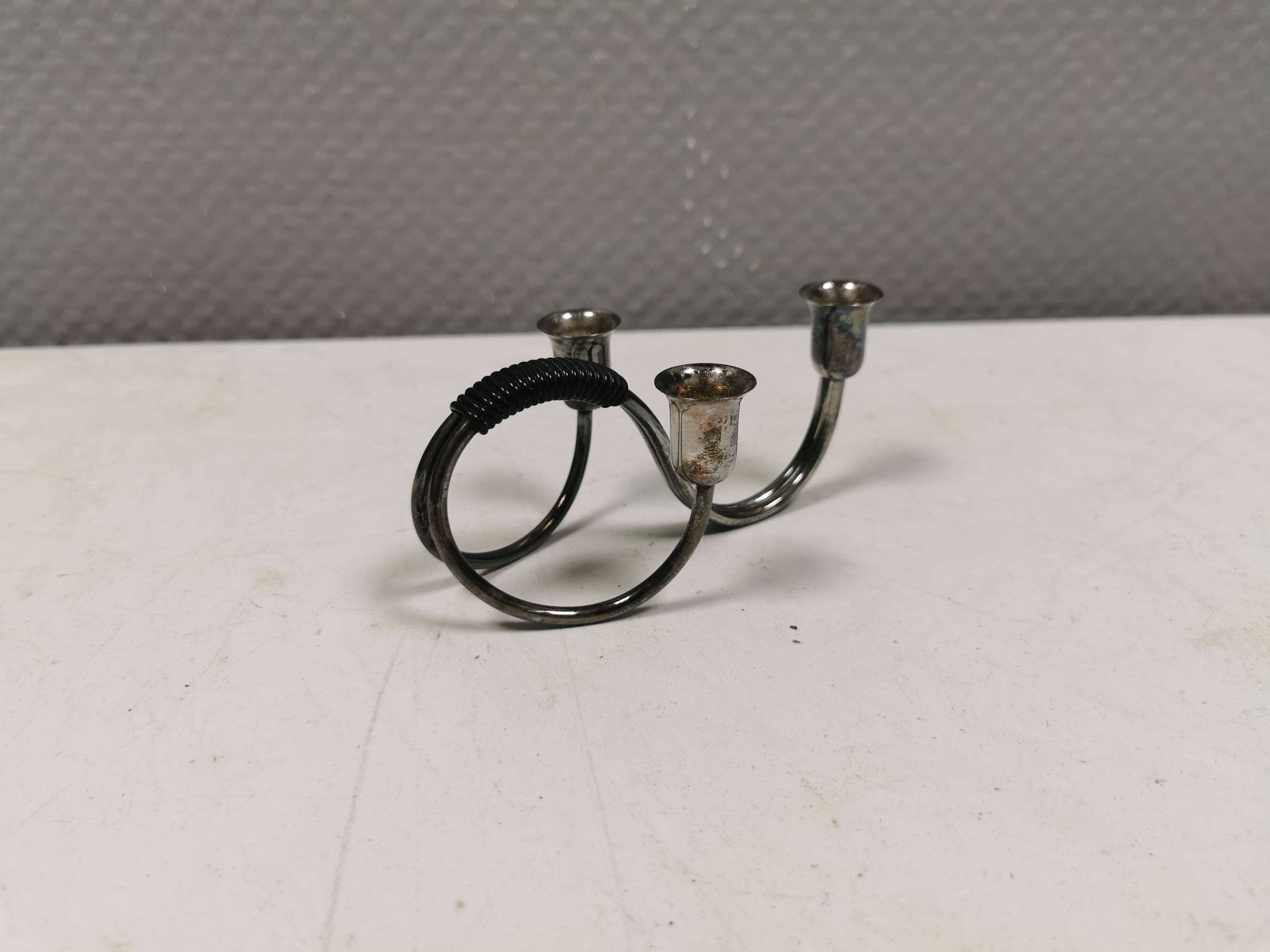 Small candle holder in tarnished silver, with place for three small candles