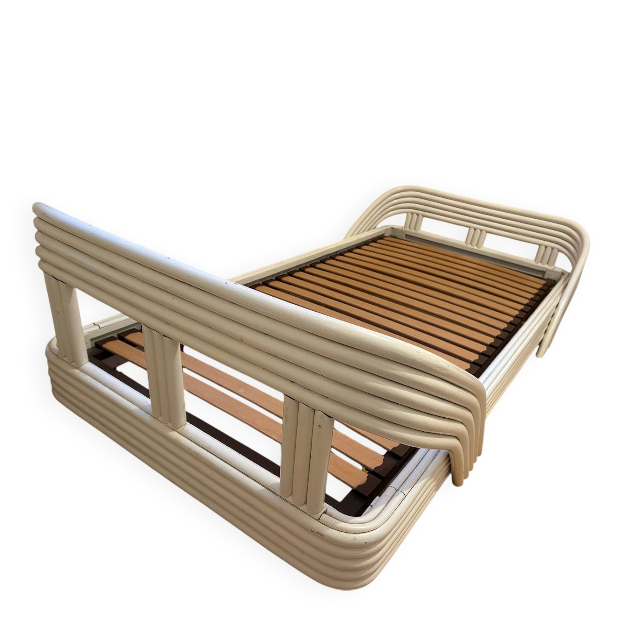 Vintage white rattan bed from the 1960s.