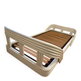 Vintage white rattan bed from the 1960s.