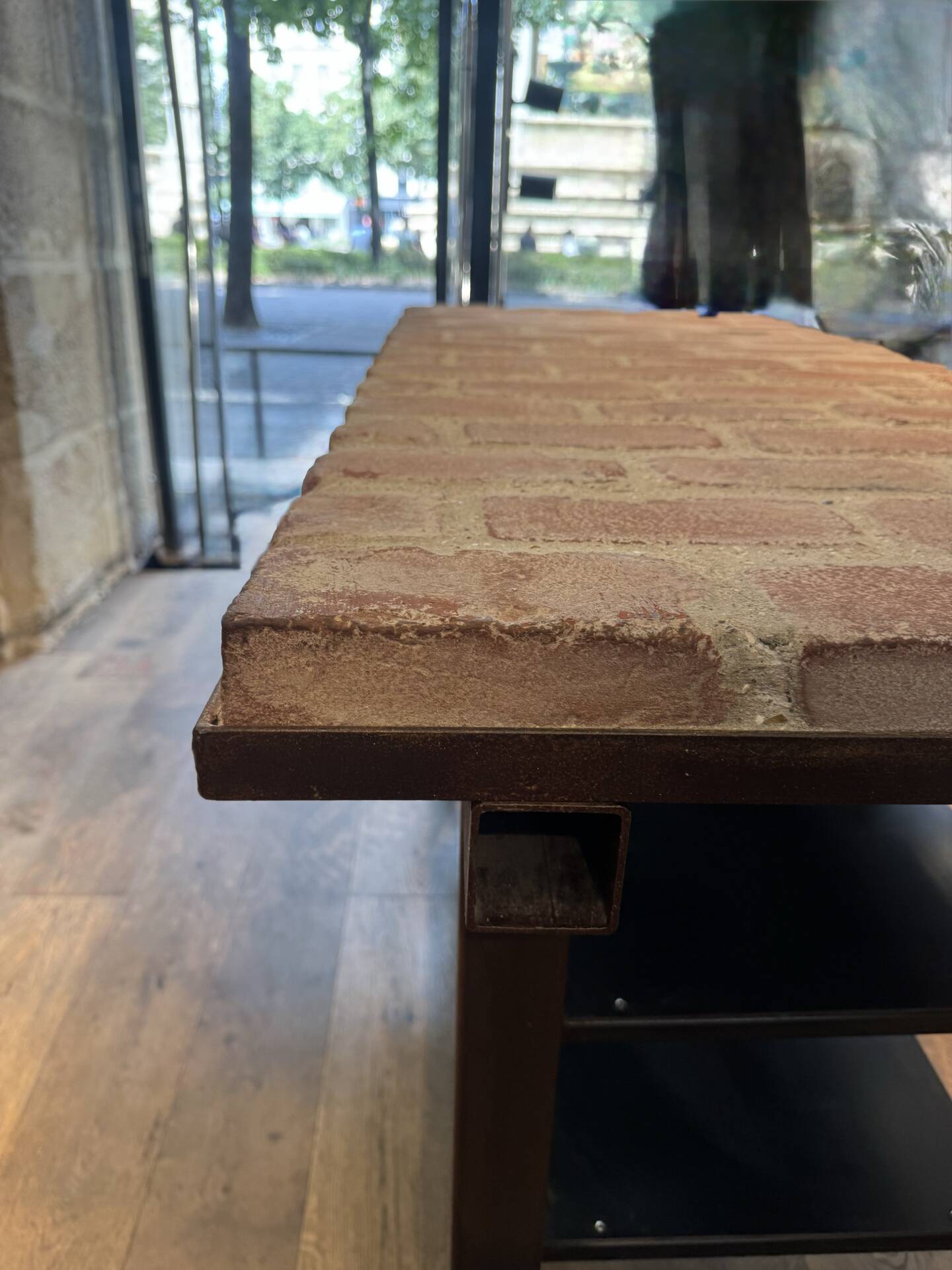Industrial style creator table in bricks and metal on wheels.