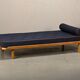 Scandinavian Daybed in Oak and dark Blue bouclé fabric with Leather accents