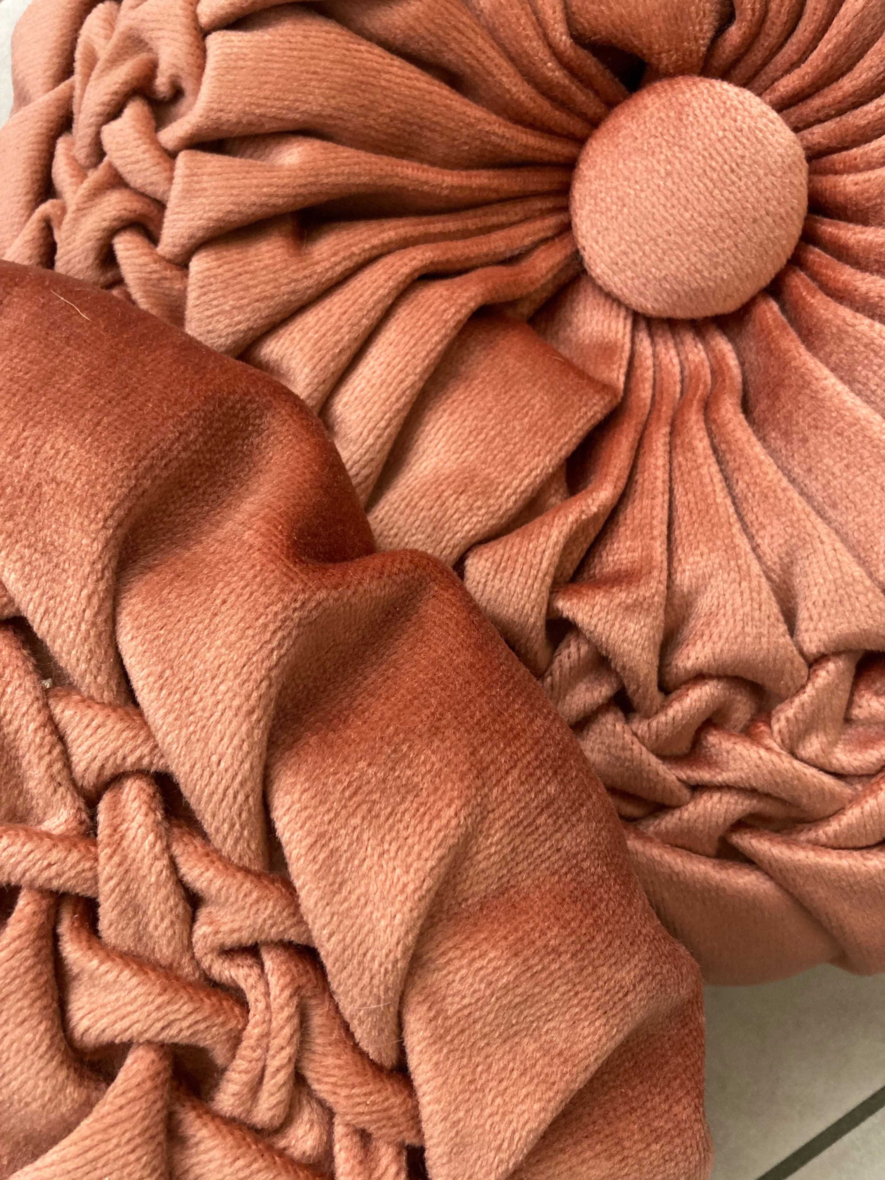 Pair of round vintage pleated velvet cushions