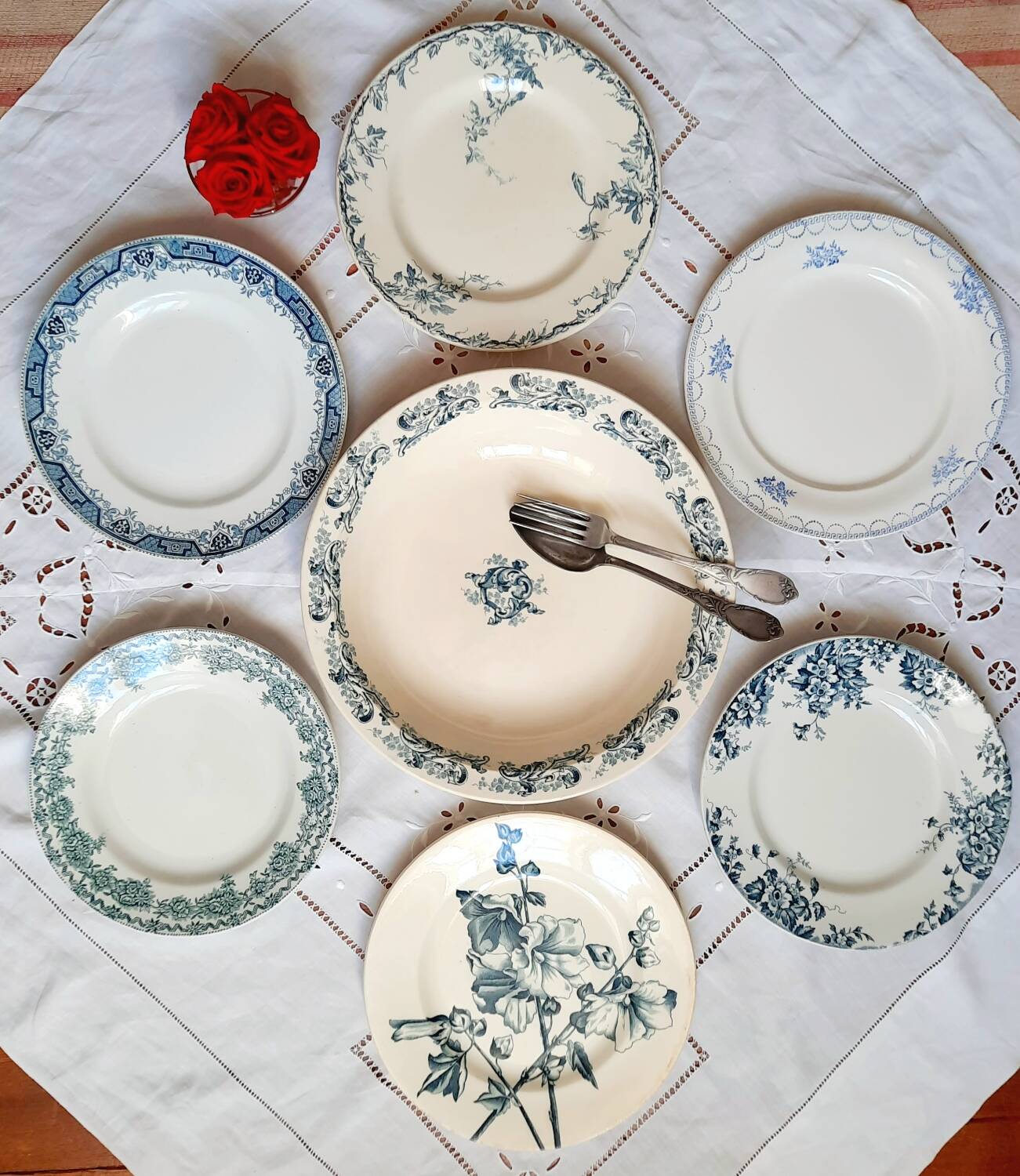 Old mismatched dinner plates accompanied by a dish