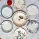 Old mismatched dinner plates accompanied by a dish