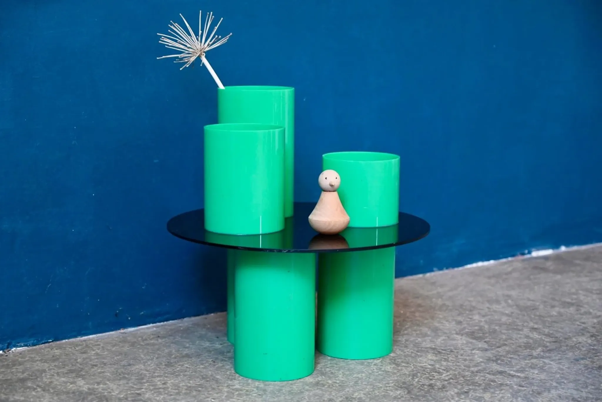 Green plexiglass coffee table in Memphis design style from the 1980s.