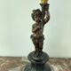 Candelabra with cherub in patinated bronze