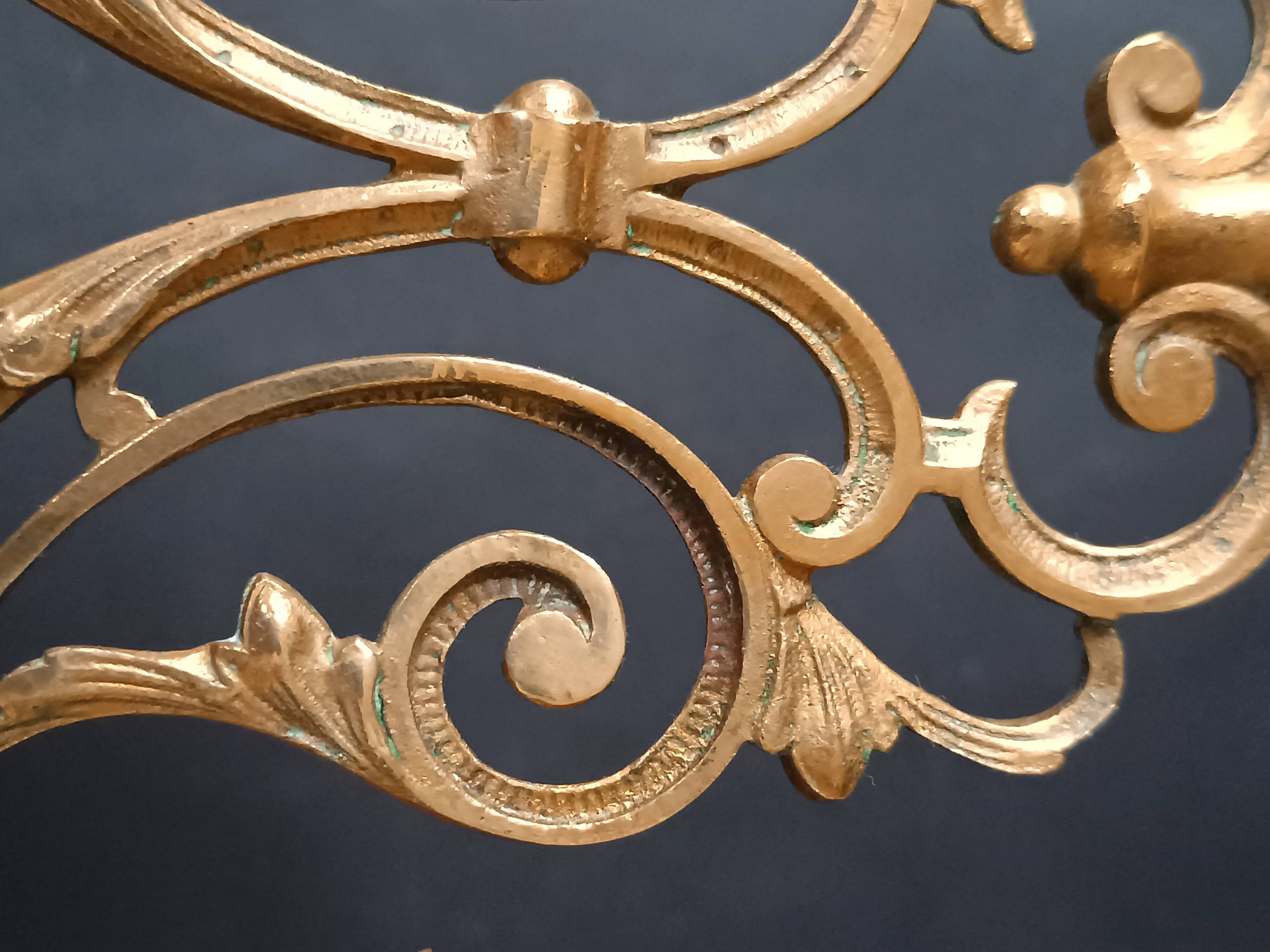 Antique three-light openwork brass church candelabrum.