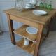 Meuble de métier vintage en chêne sur roulettes.