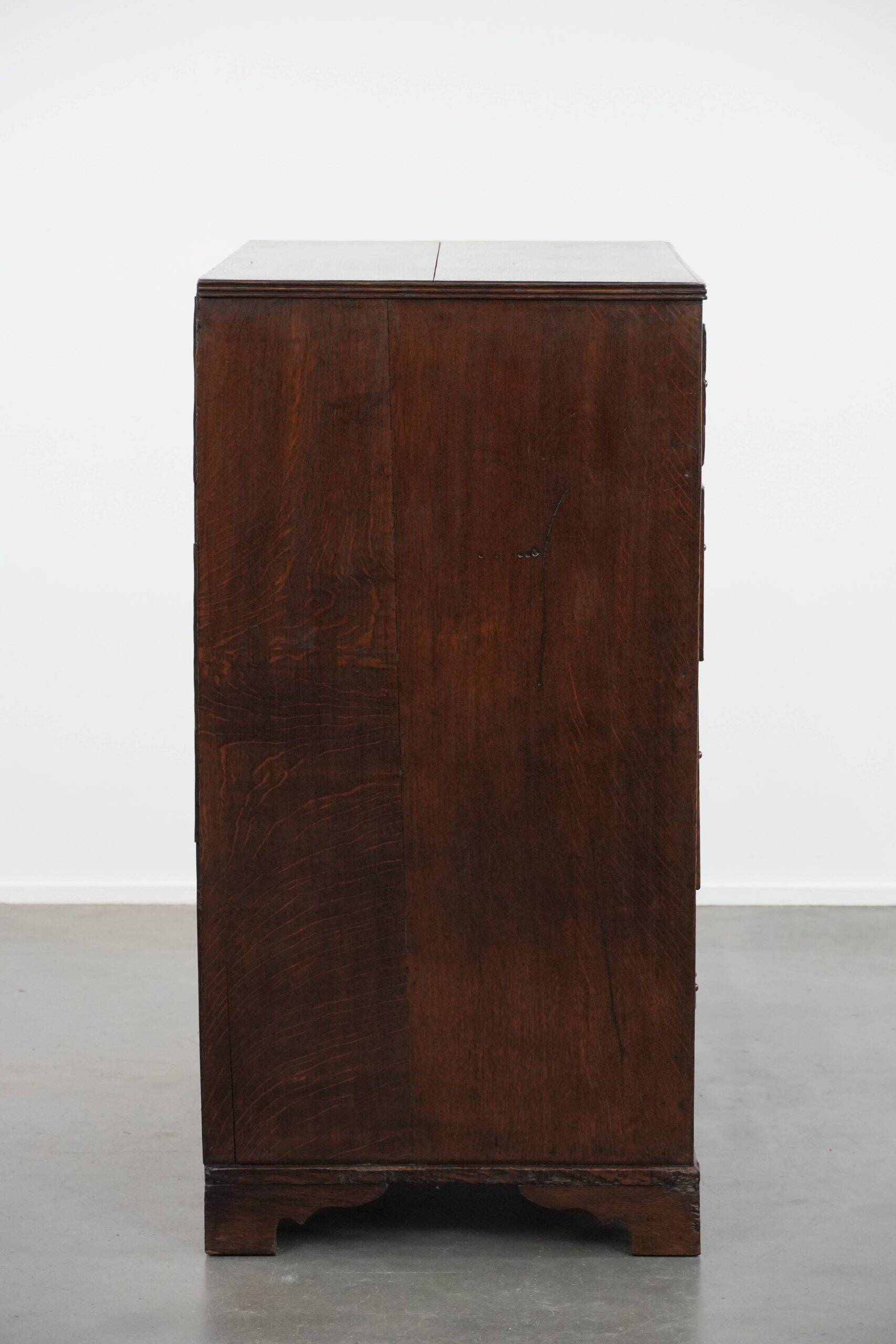 Antique English oak commode dating from the late 18th century.