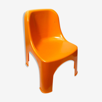 Children's chair in orange plastic