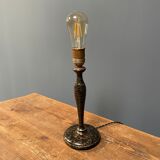 Black table lamp with paint splatters from the 1920s