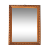Small old wooden mirror with carved frame
