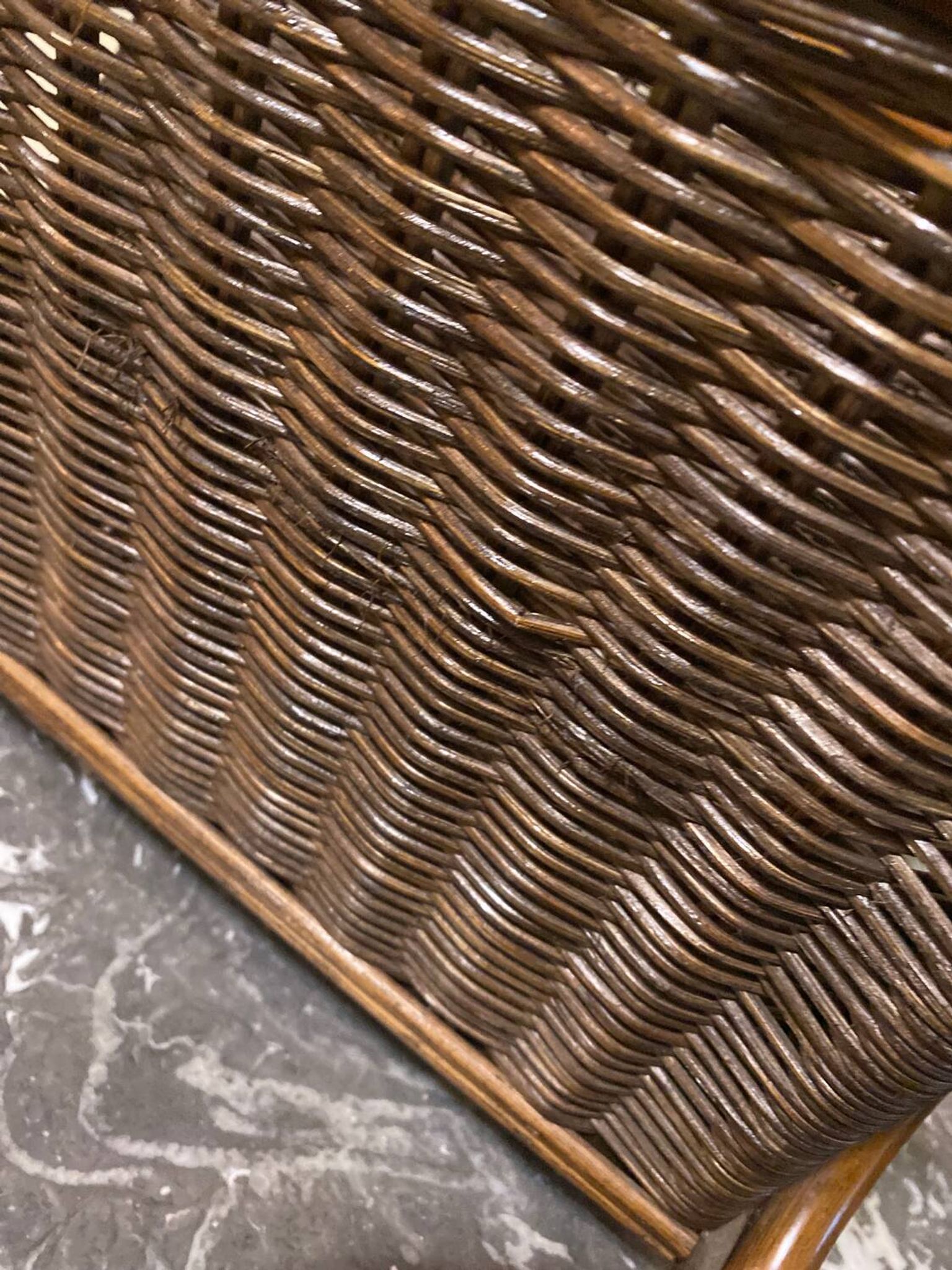 Wicker and brown wood magazine rack