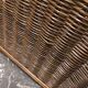 Wicker and brown wood magazine rack