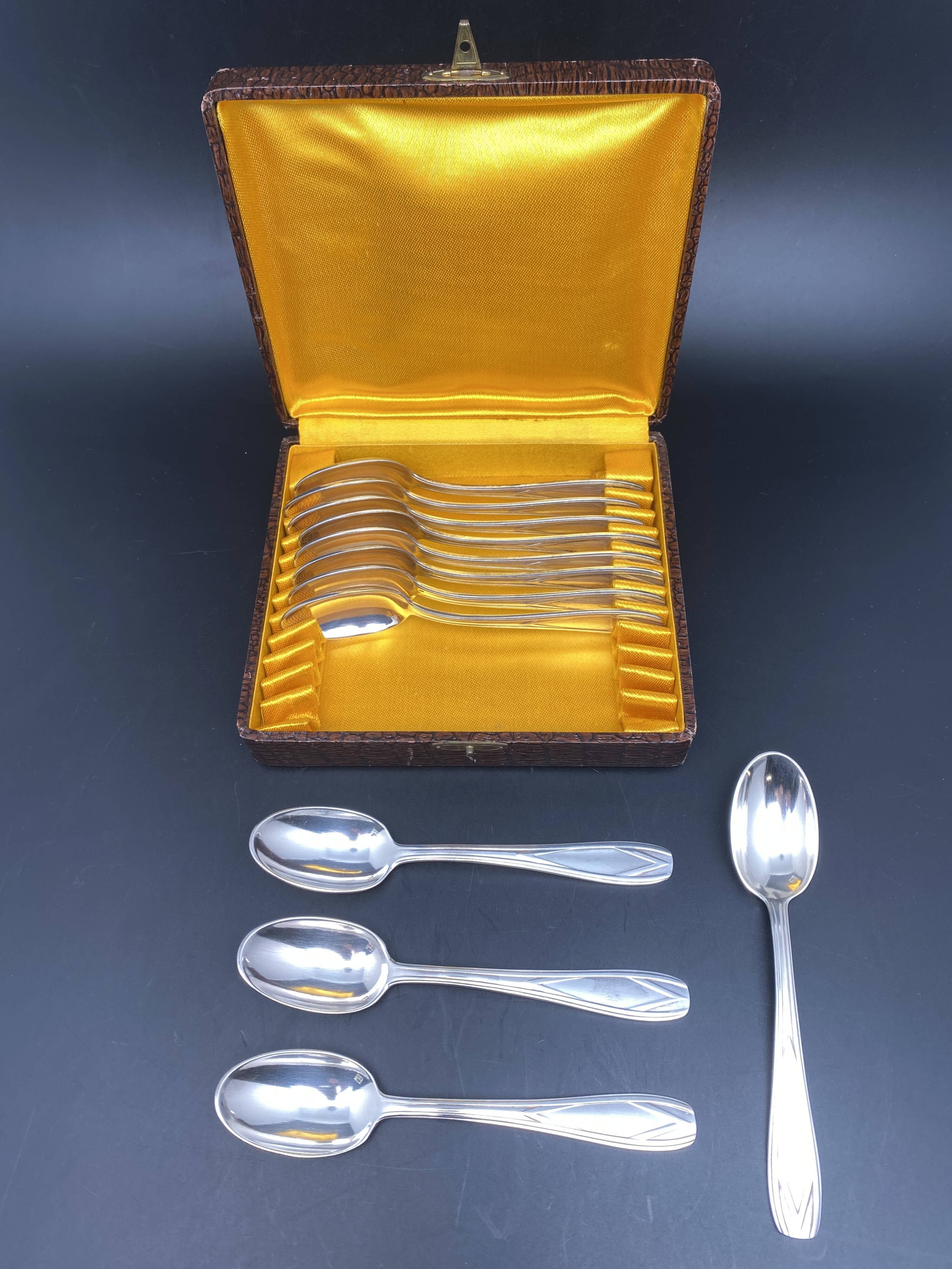 Dessert spoons in silver-white metal