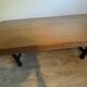 Industrial style table with a mahogany top.