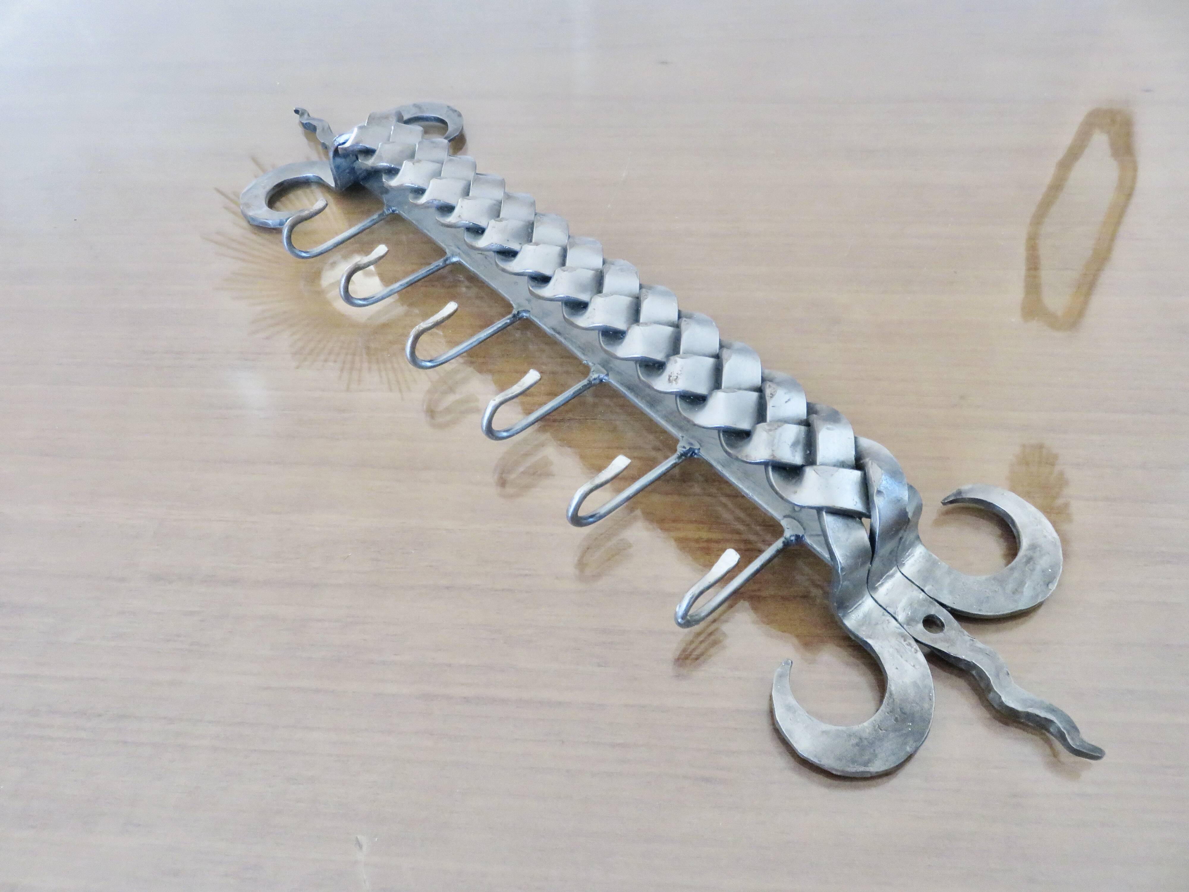 2 Tea towel holders, ironwork in braided raw steel, 1970