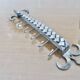2 Tea towel holders, ironwork in braided raw steel, 1970