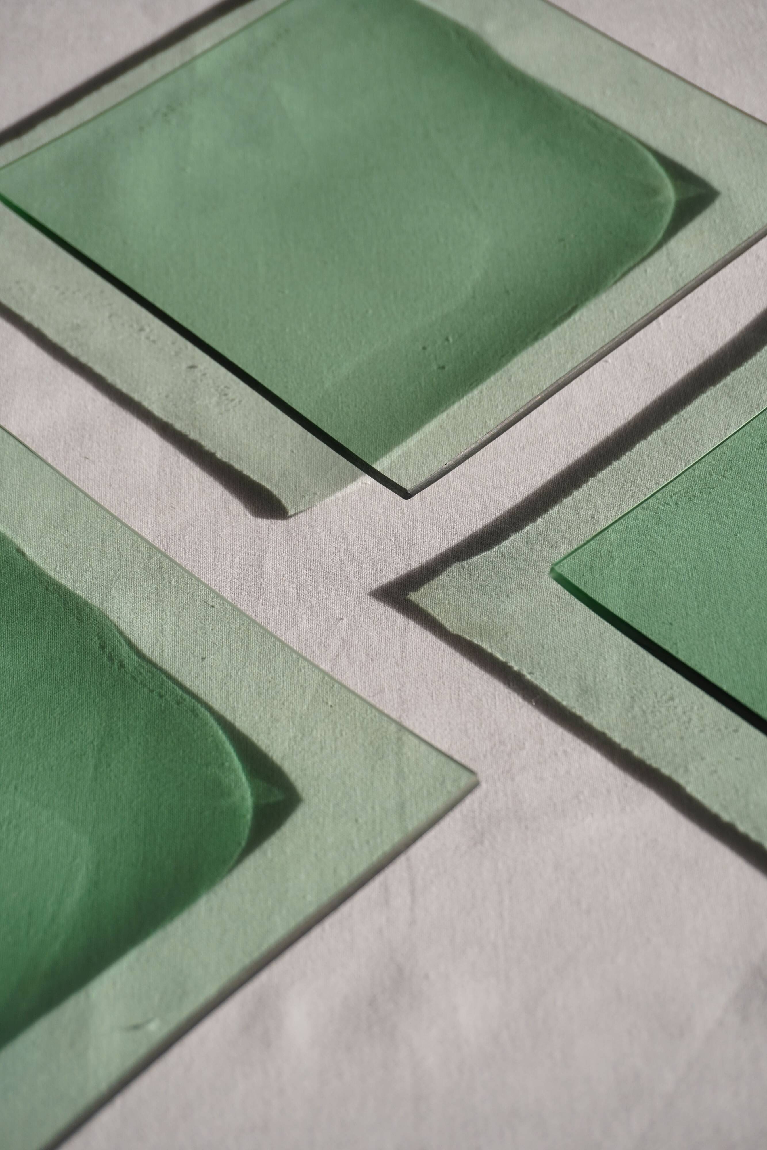 Set of 4 small square green glass plates/bowls