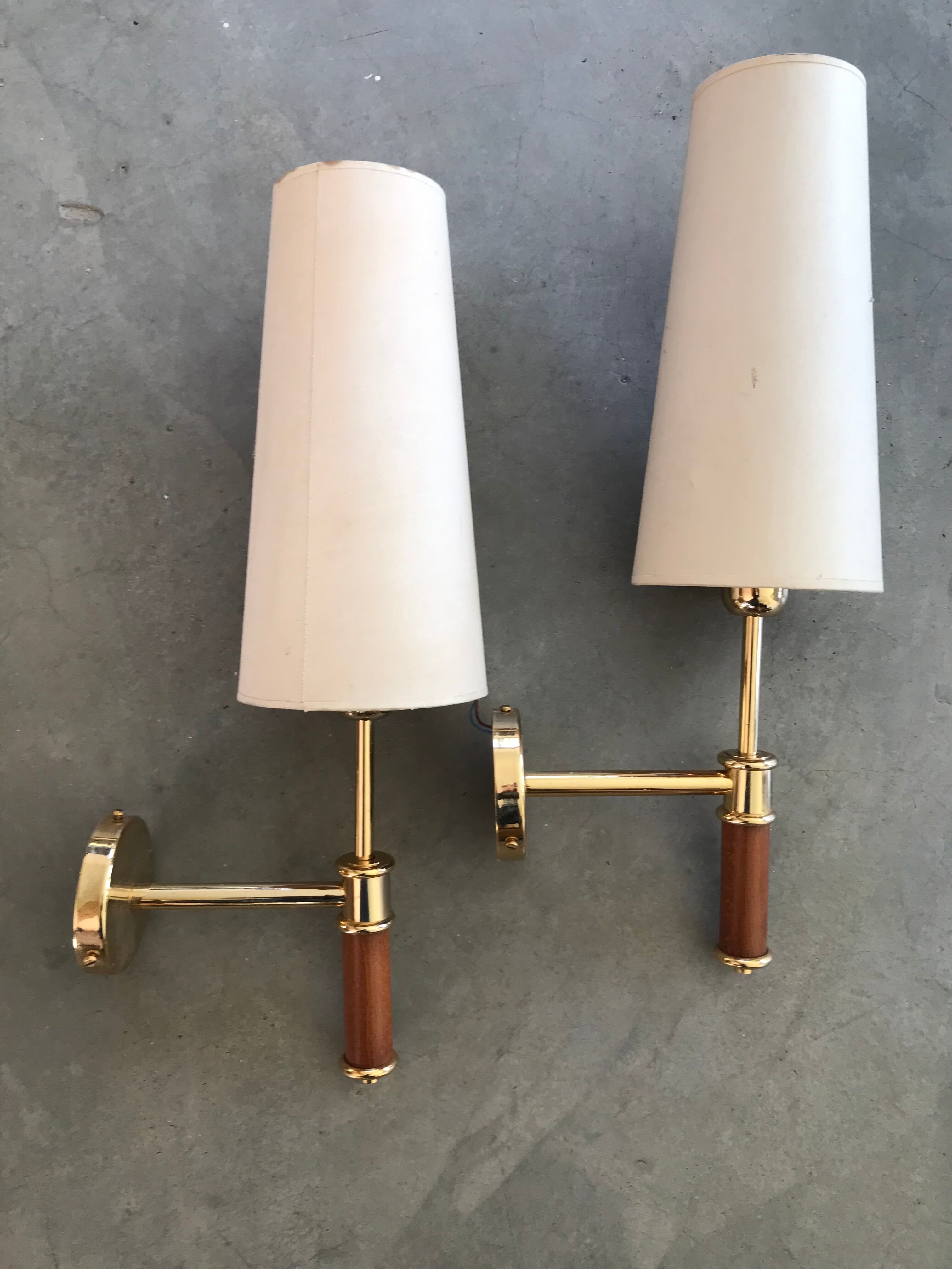Pair of modernist sconces in wood and gilded metal.