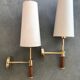 Pair of modernist sconces in wood and gilded metal.