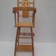 Chaise haute ancienne de poupée en bois clair décor papillon