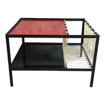 Modernist metal coffee table with a magazine rack in 1950s design.