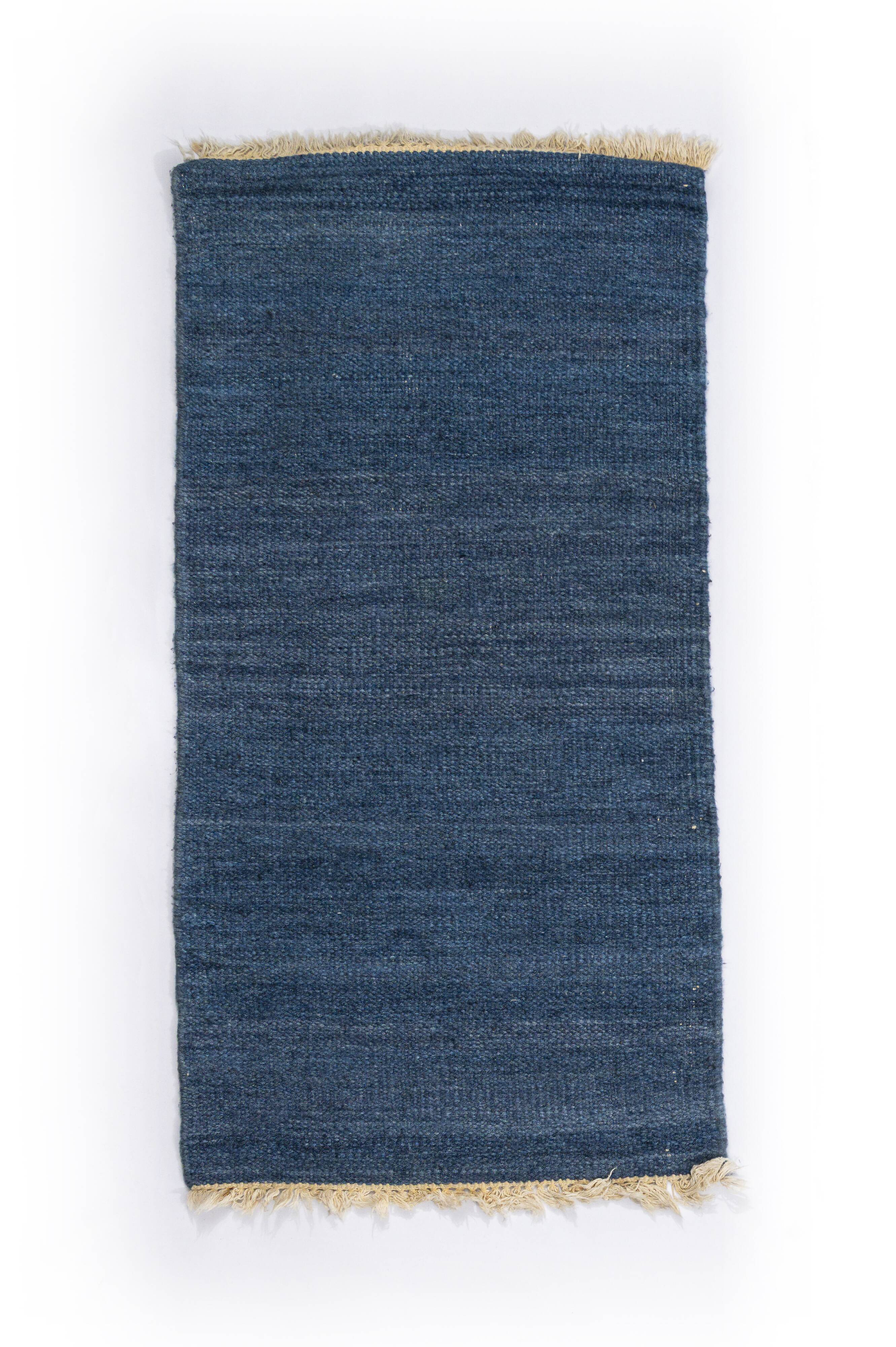 Scandinavian style minimalist flat weave rug. A small one.