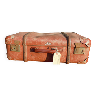 brown suitcase with wood