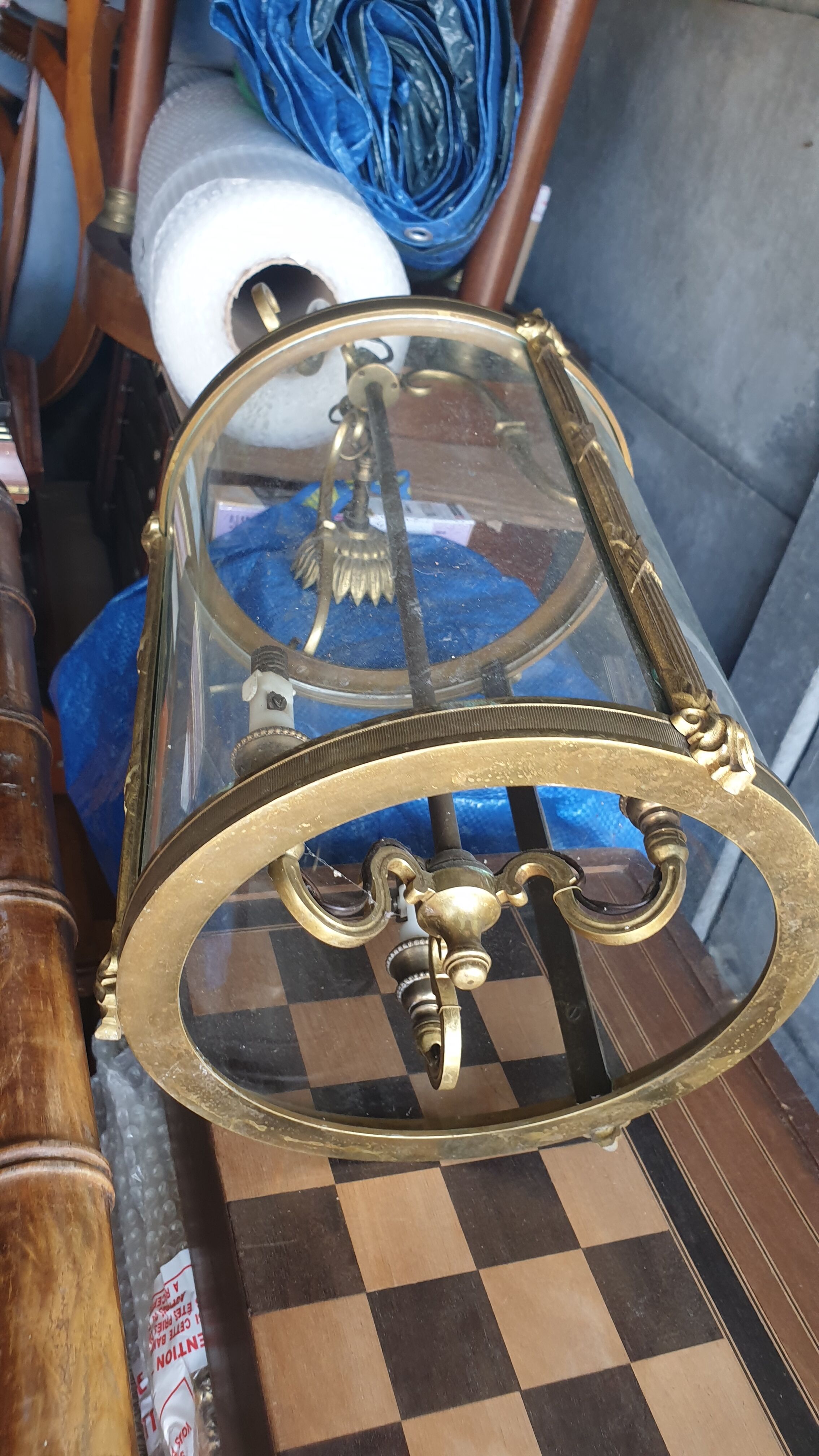 Suspension in glass and brass