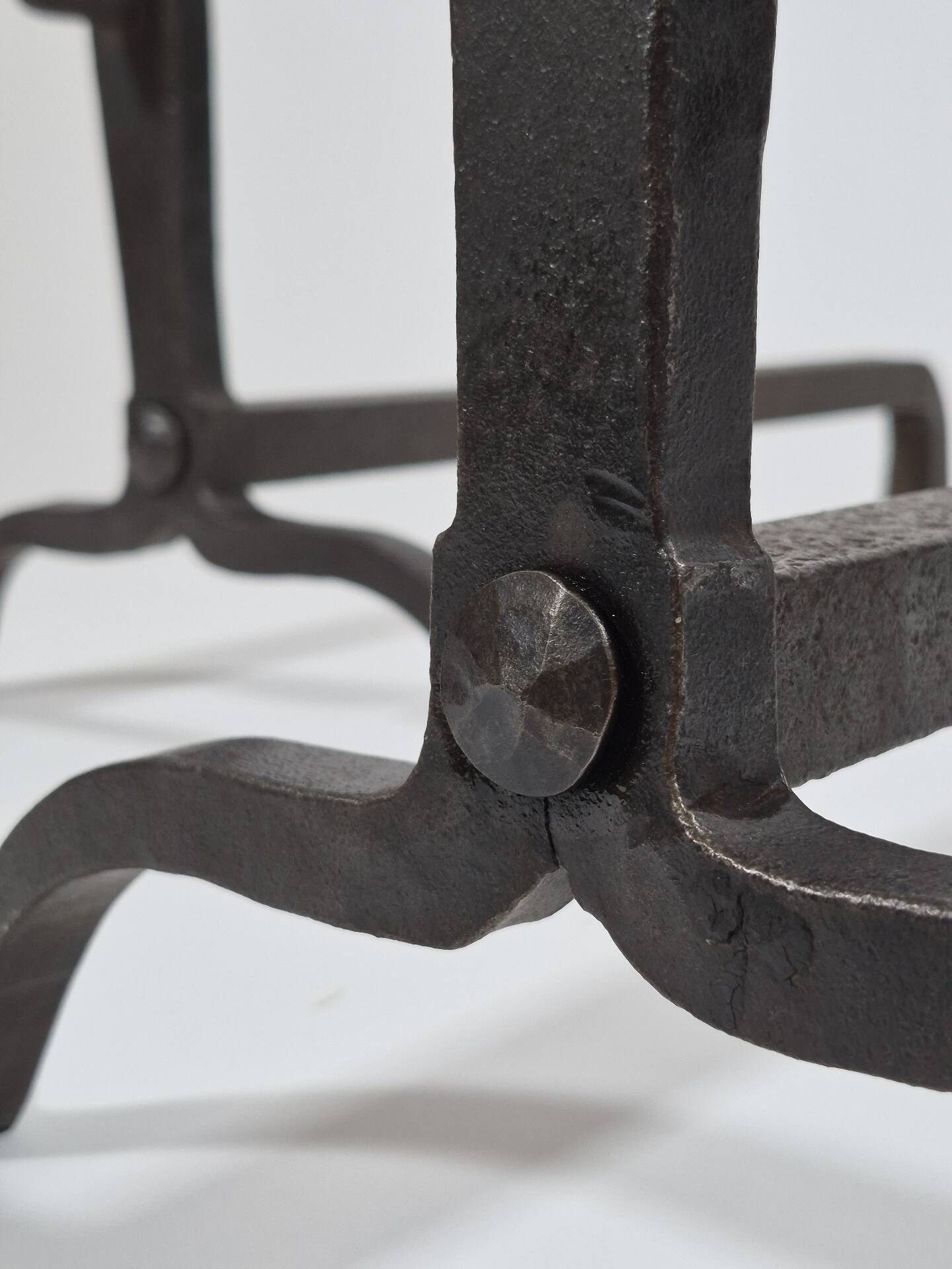 Pair of handforged metal and brass andirons