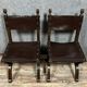 Pair of medieval style chairs in solid wood and leather, 19th century, circa 1850