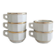 5 vintage porcelain bistro coffee cups from Paris with gold trim.