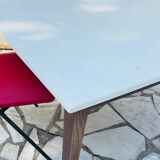 Vintage oak farmhouse table with a white top.