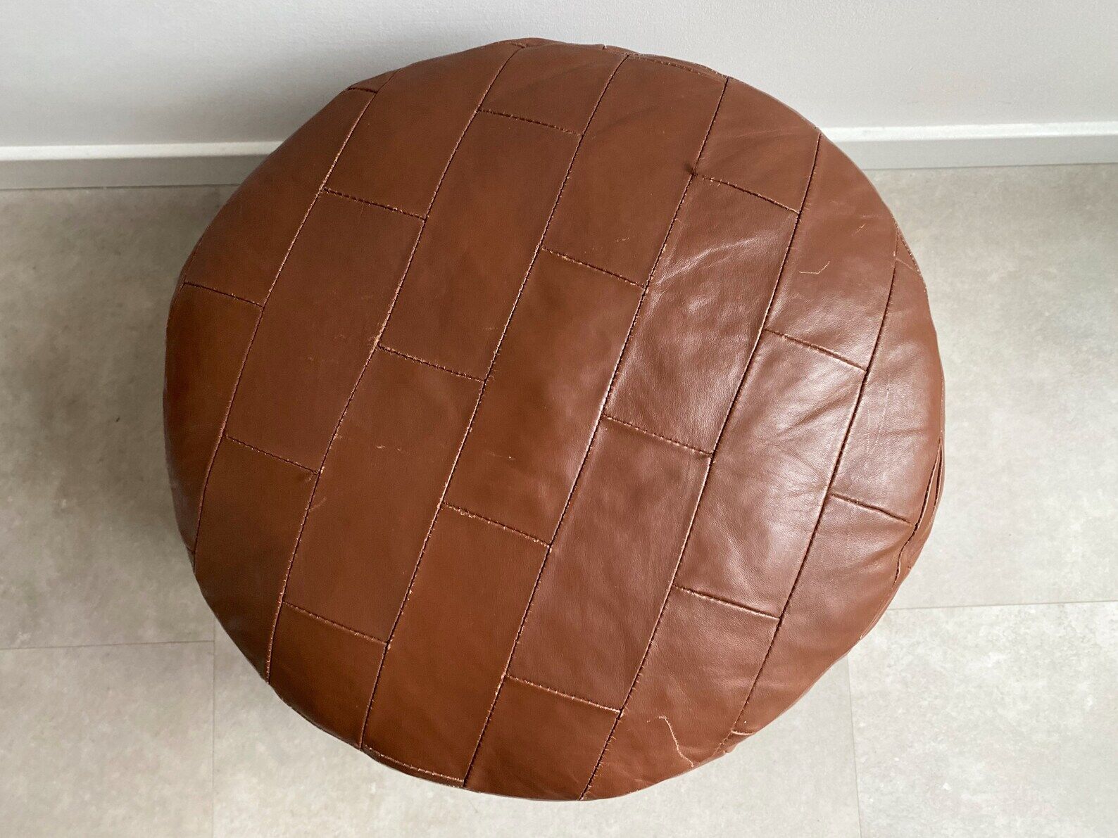 Vintage brown patchwork round leather ottoman / poof / bench