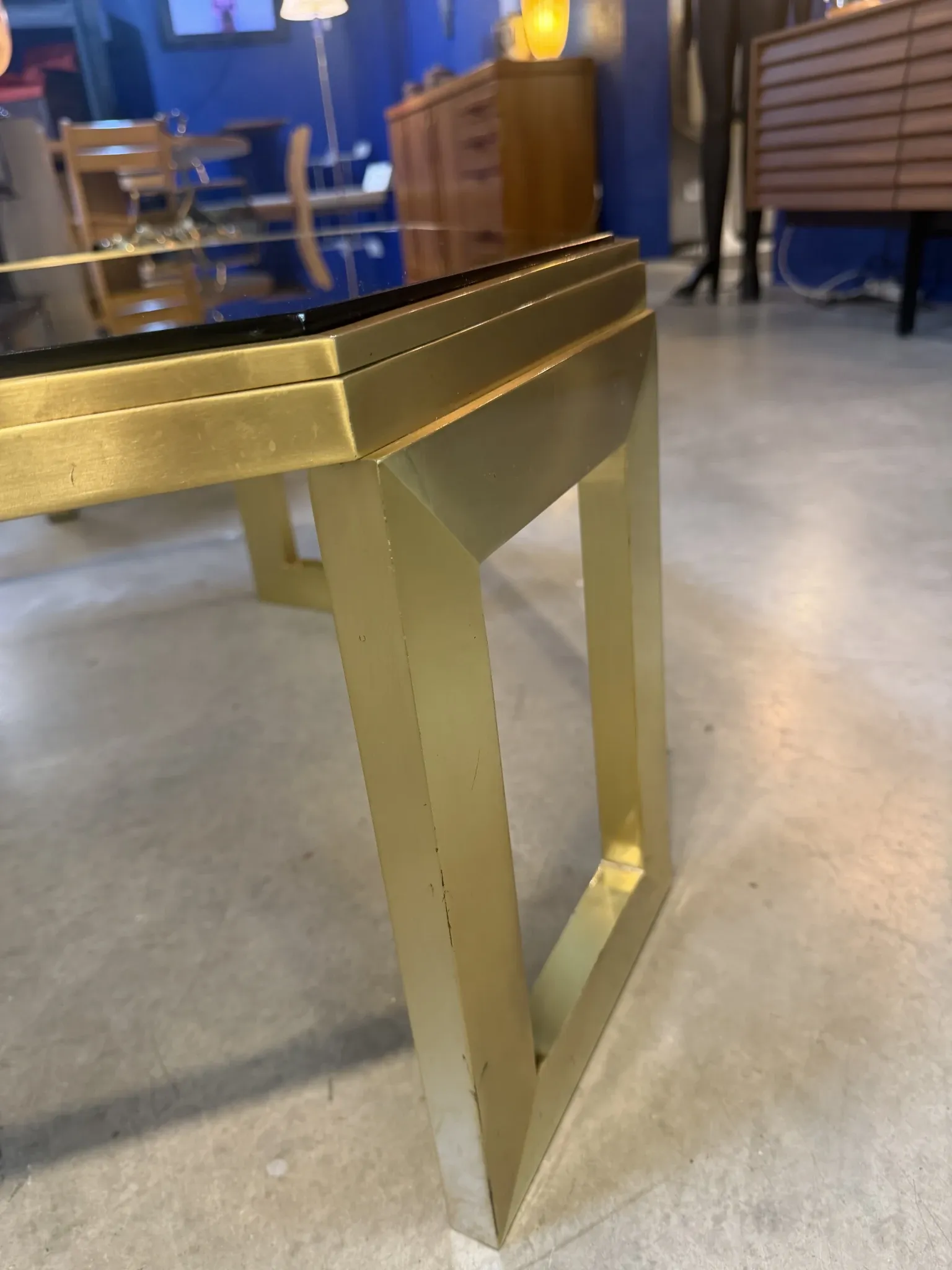 Octagonal brass coffee table, signed Anna Nora.