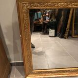 Old 19th century mirror in wood and gilded stucco