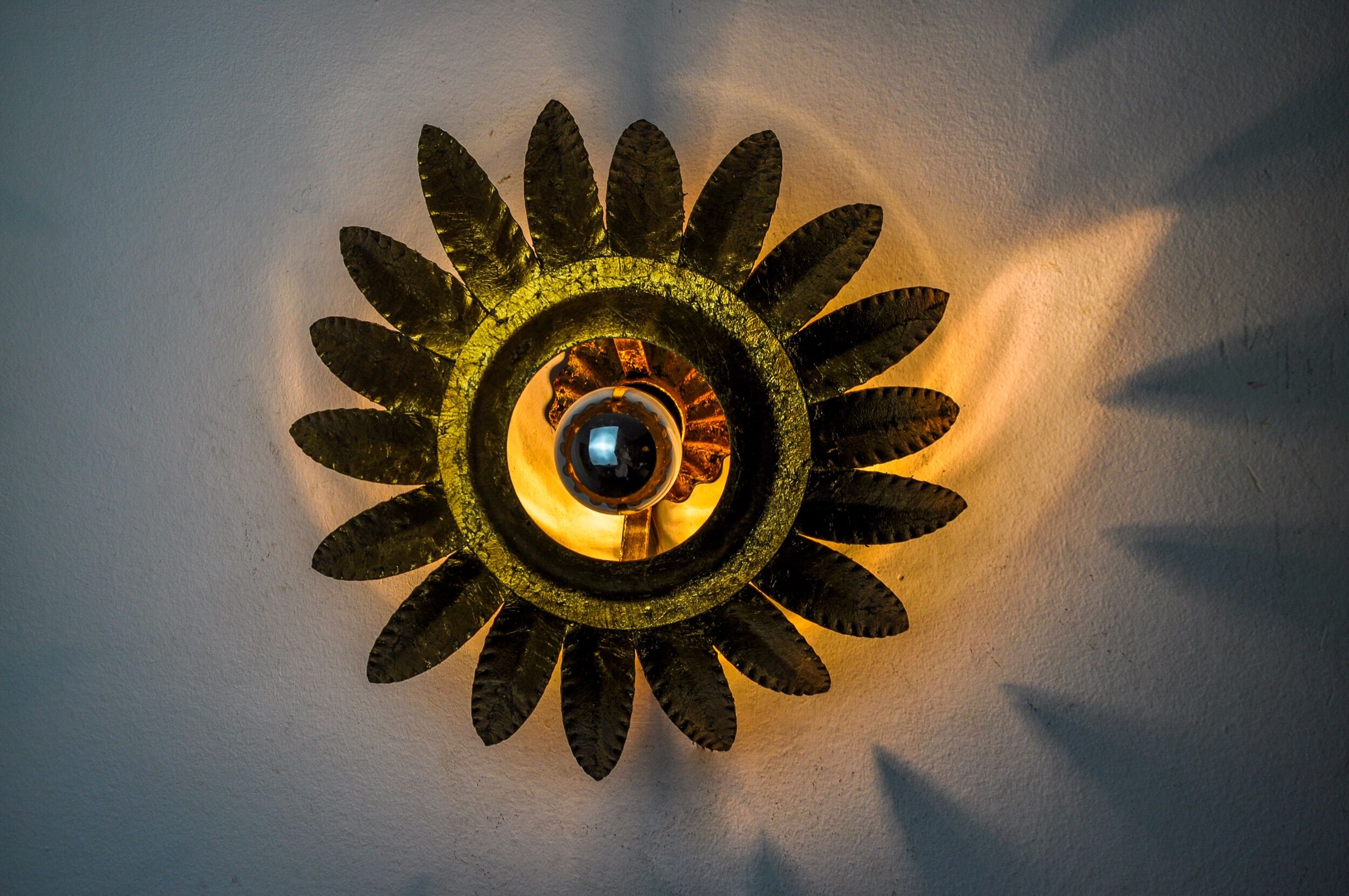 Sun wall lamp by ferro arte, metal and gold leaf, Spain, 1960