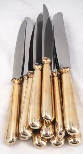 12 table knives model Baguette, golden handles, excellent condition.