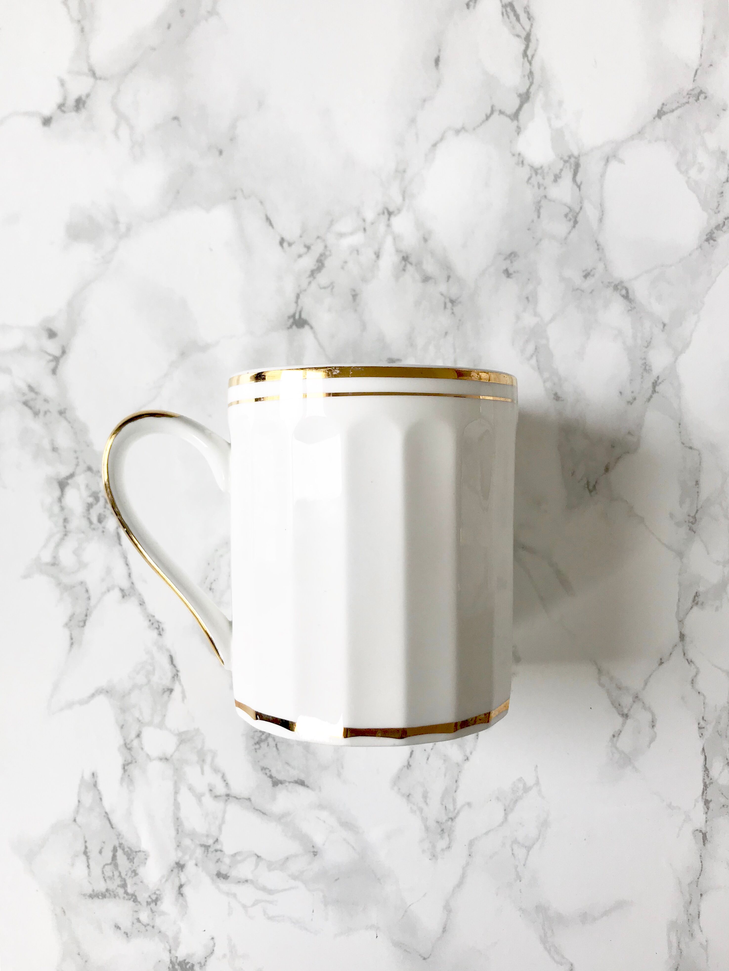 Set of 7  cups in white and gold porcelain