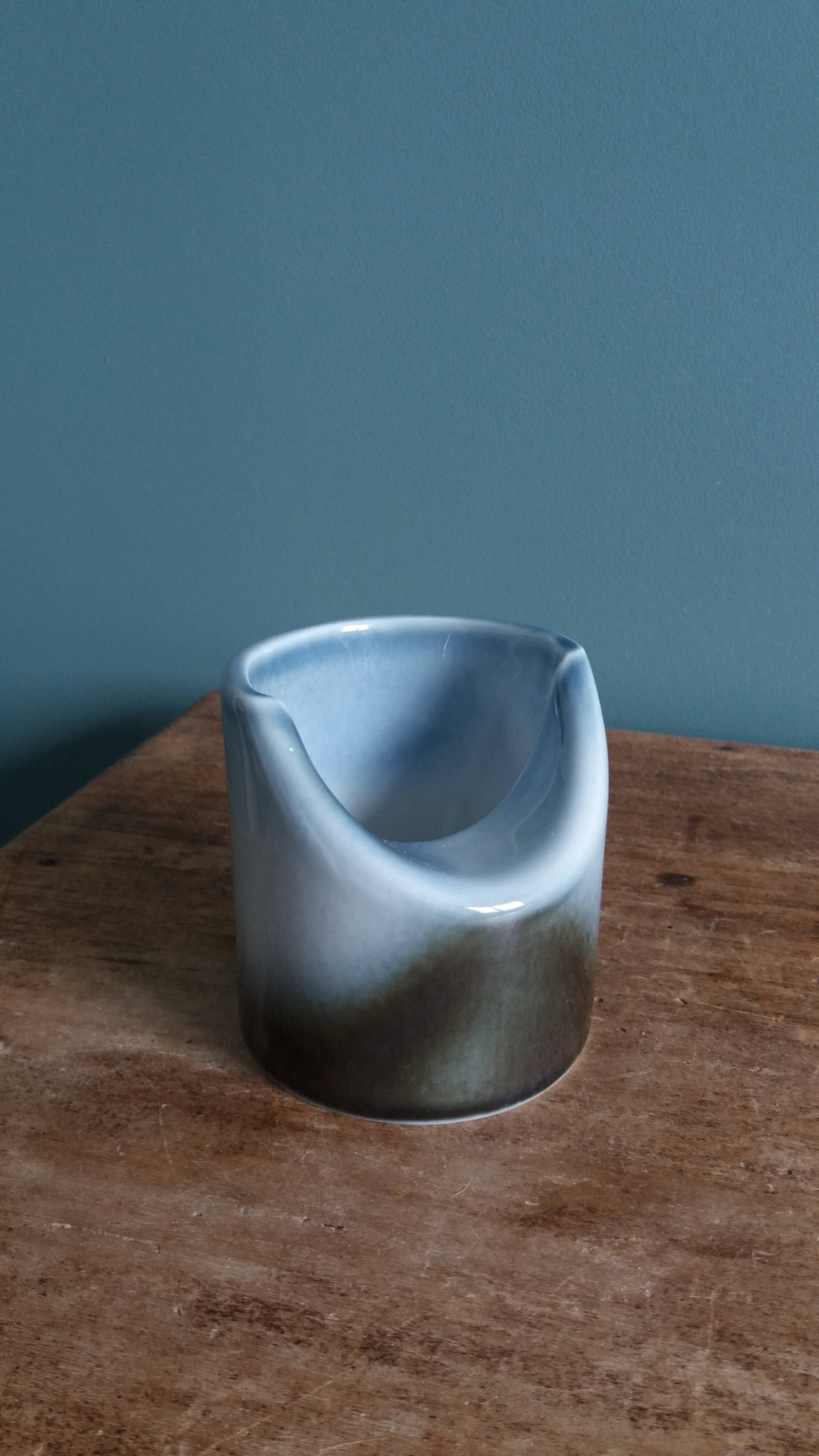 Vase Virebent porcelain cylindrical roll shape with a deep neck.