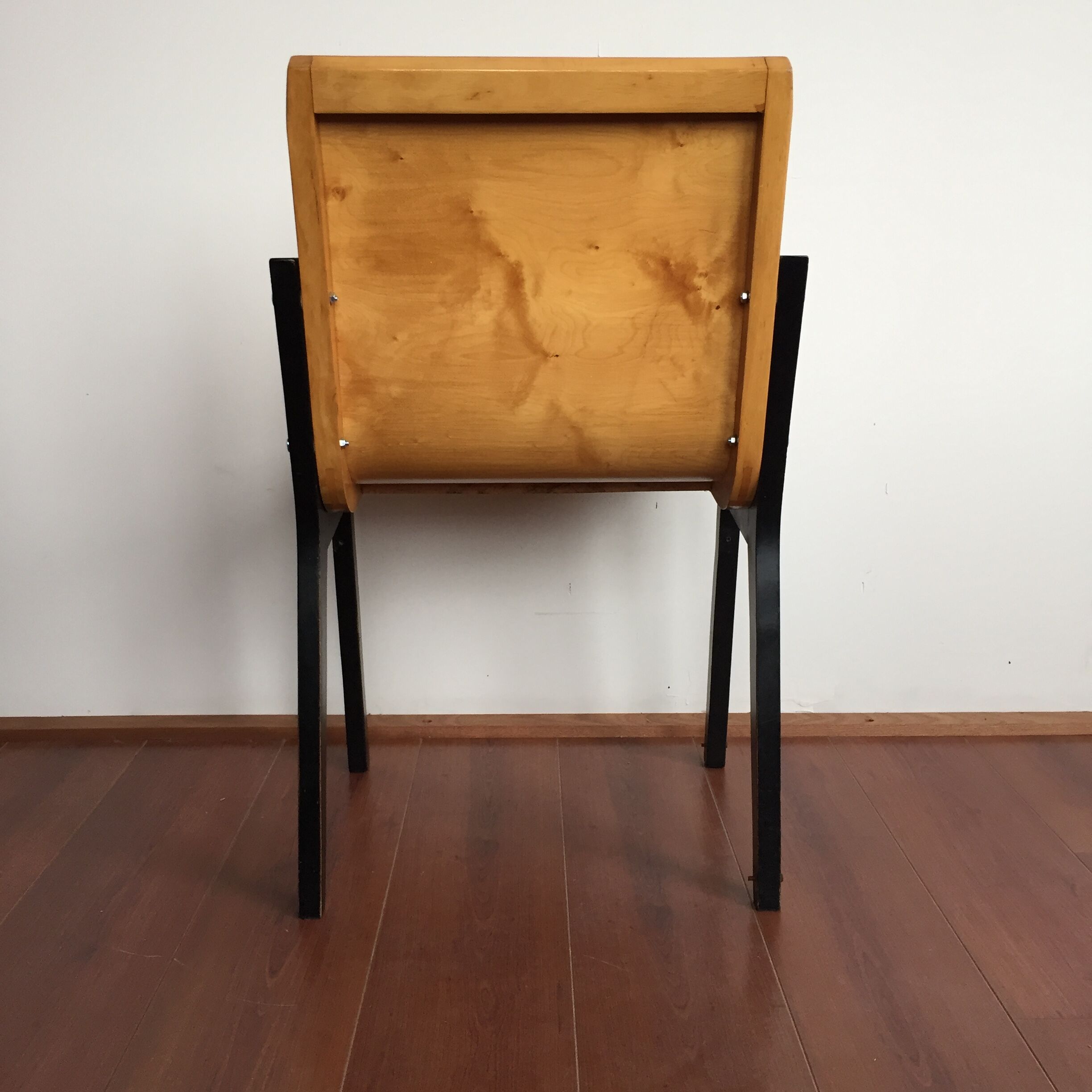 1950s church or school chairs in beech plywood and black stained wood by Roland Rainer