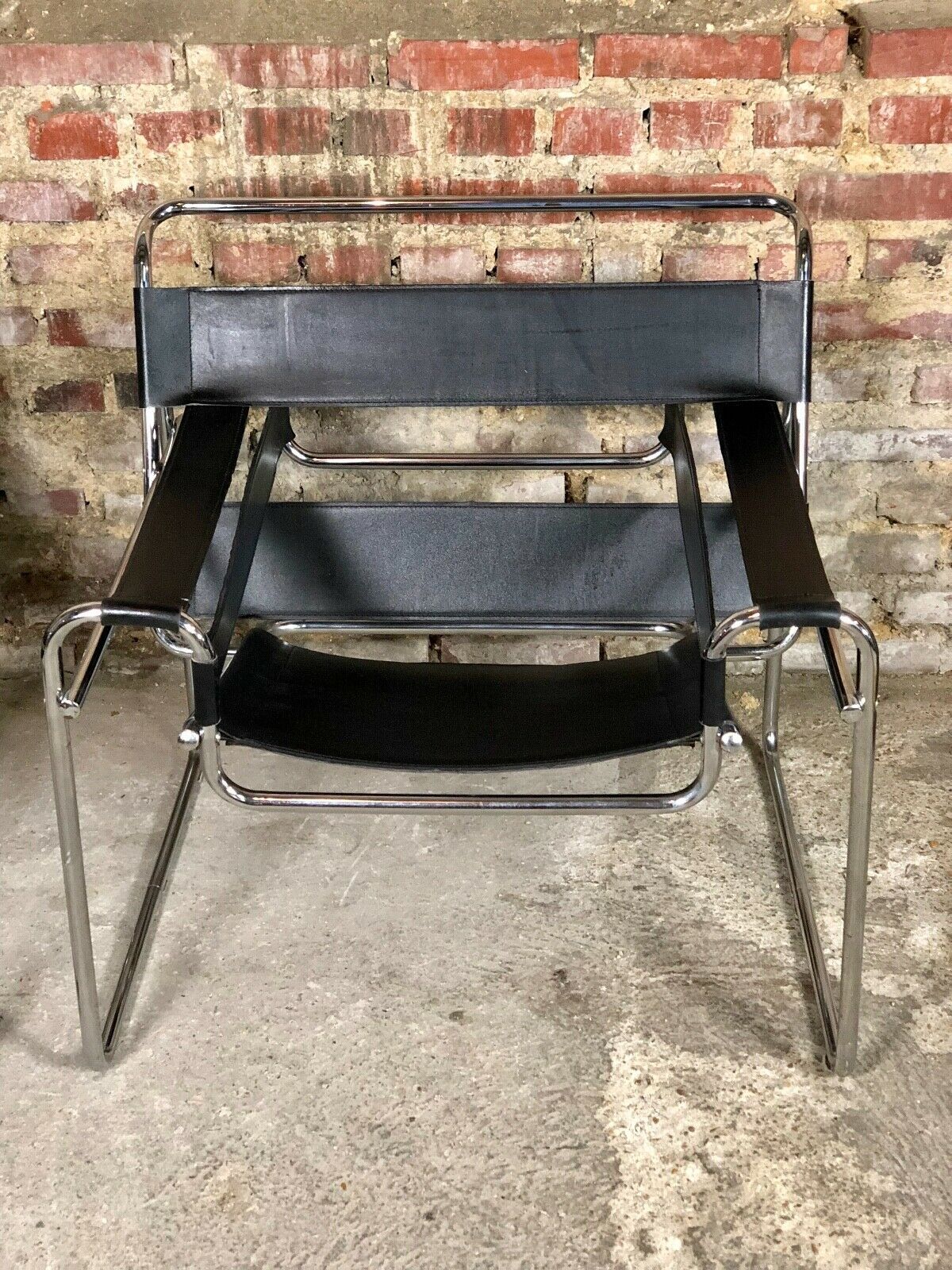Pair of Marcel Breuer's Wassily armchairs in stainless steel and 60's leather