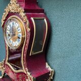 Boudoir clock on Louis XIV style console.