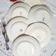Old mismatched earthenware dinner plates