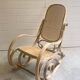 Rocking chair with a cane seat and backrest.