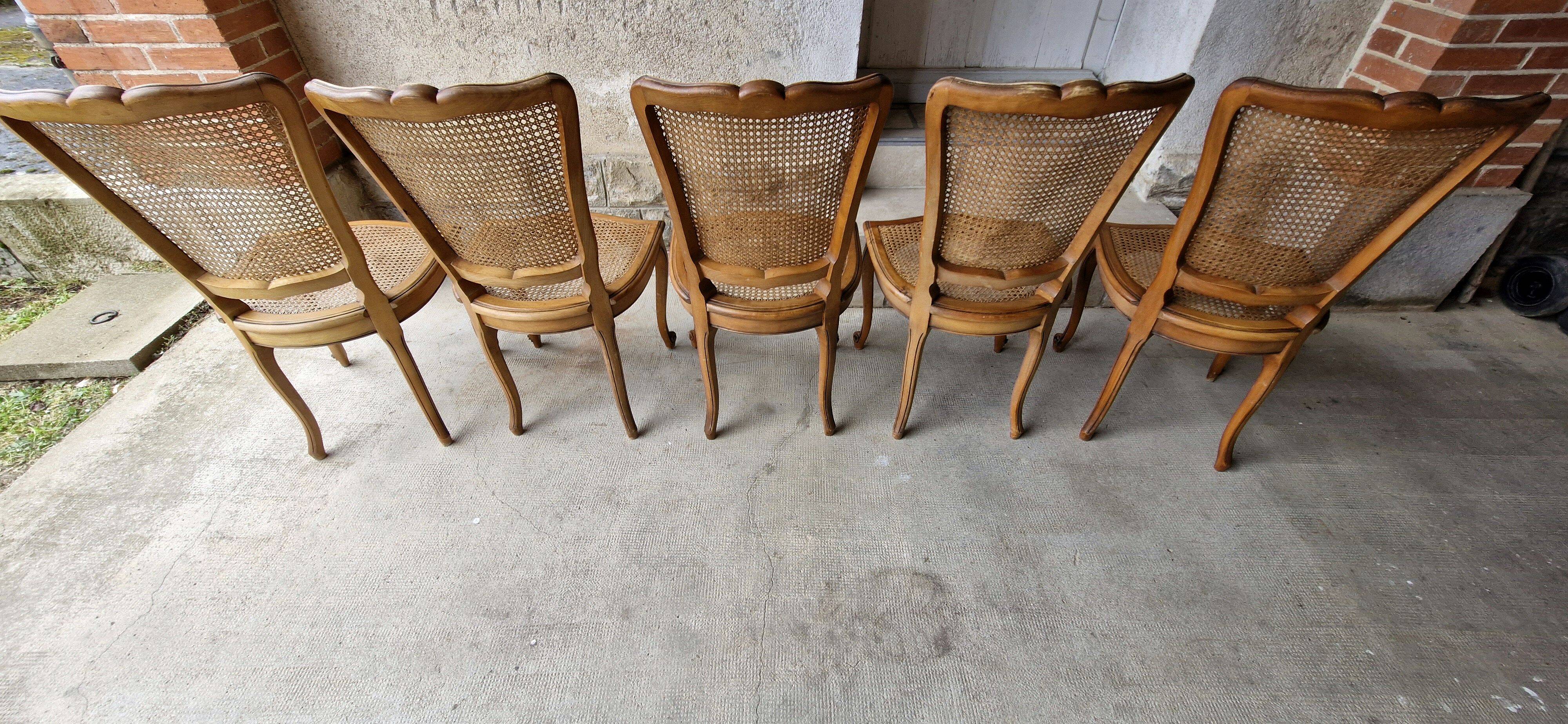 5 old cane-seated solid oak chairs.